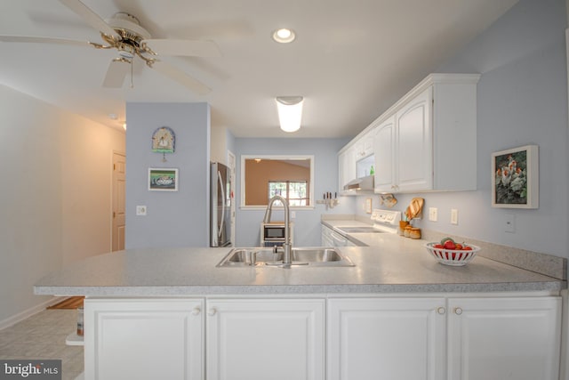 kitchen featuring white cabinetry, stainless steel refrigerator, white electric stove, sink, and ceiling fan