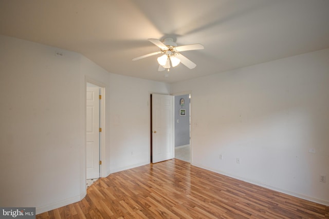 unfurnished room with light wood-type flooring and ceiling fan