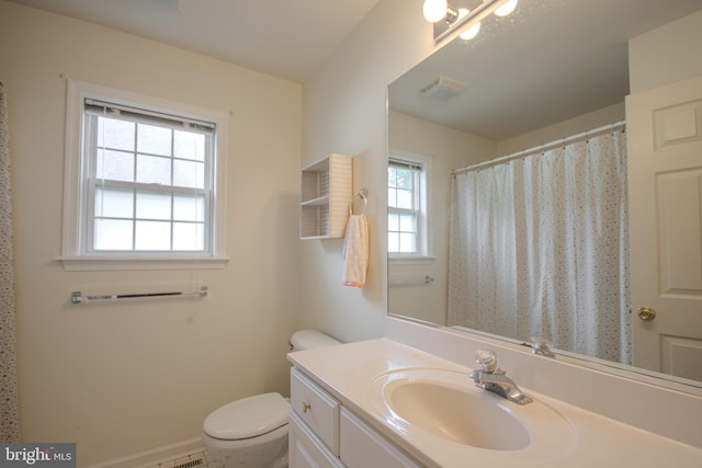 bathroom with vanity, tile patterned floors, and toilet