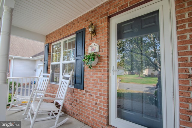 doorway to property featuring covered porch