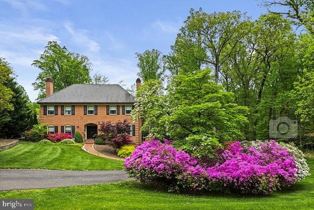 1175 Daleview Dr, Mclean, VA 22102 - view of front of home featuring a chimney and a front yard