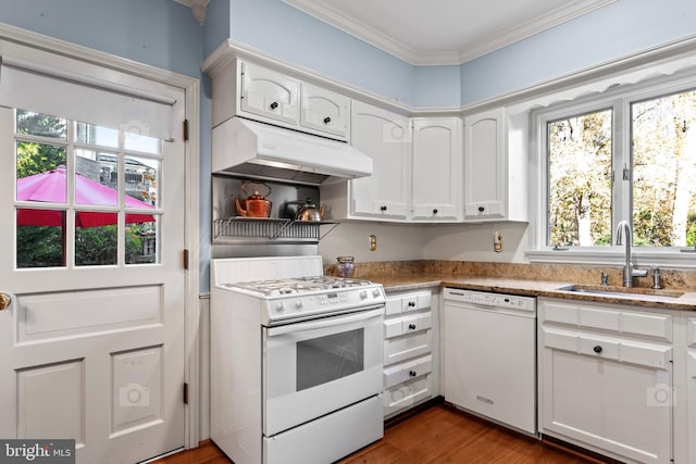 kitchen with white cabinetry, sink, plenty of natural light, and white appliances