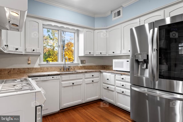 kitchen featuring white appliances, sink, white cabinetry, dark wood-type flooring, and ornamental molding