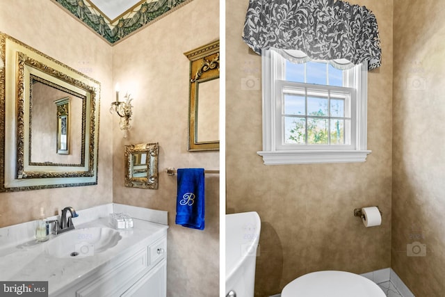 bathroom featuring vanity and toilet