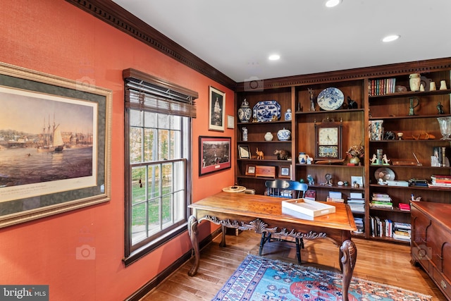 home office with a wealth of natural light and light wood-type flooring