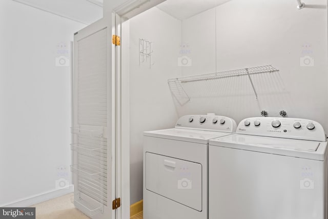 laundry room with washing machine and clothes dryer