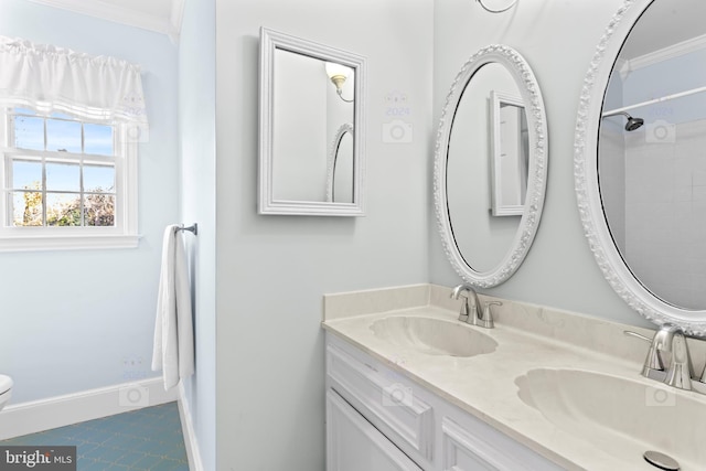 bathroom featuring vanity, ornamental molding, toilet, and tile patterned floors