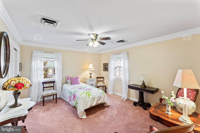 bedroom featuring carpet, crown molding, and ceiling fan