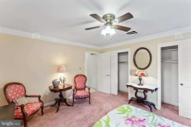 bedroom with multiple closets, light colored carpet, and ceiling fan