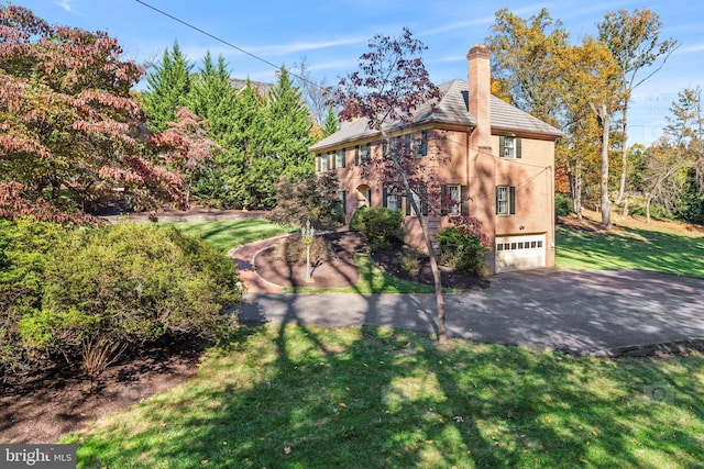 1175 Daleview Dr, Mclean, VA 22102 - exterior space with driveway, a chimney, a yard, and an attached garage
