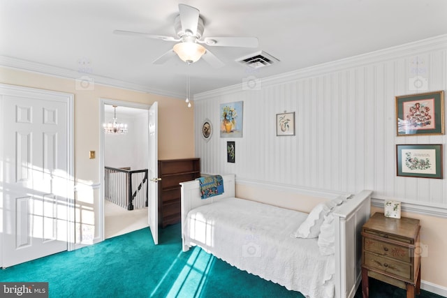 bedroom featuring carpet, ornamental molding, and ceiling fan with notable chandelier