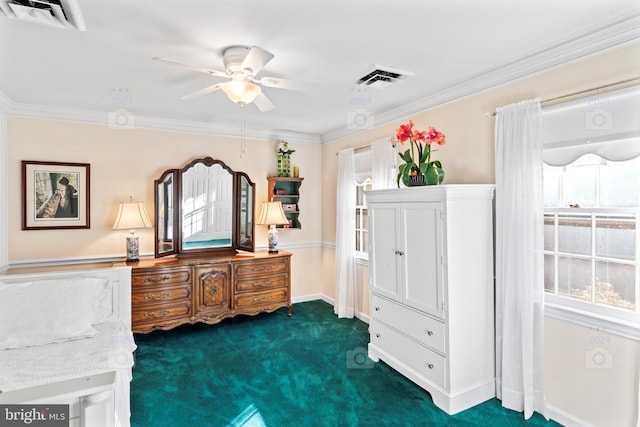 sitting room featuring crown molding, dark carpet, and ceiling fan