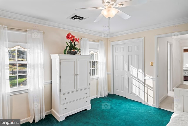 interior space featuring ceiling fan, ornamental molding, and dark carpet