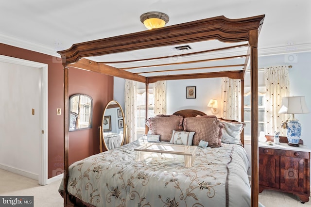 bedroom featuring crown molding and light colored carpet