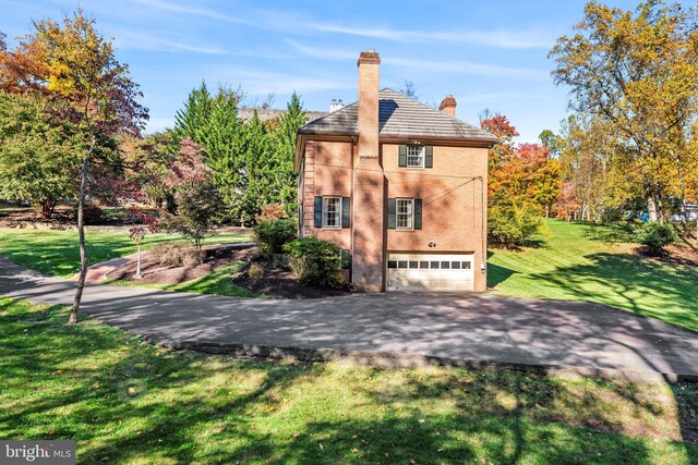 1175 Daleview Dr, Mclean, VA 22102 - view of side of home with a garage, brick siding, a yard, driveway, and a chimney