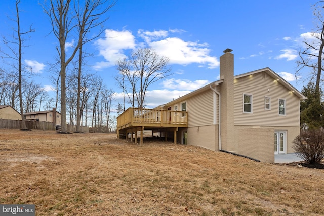 back of house featuring a wooden deck