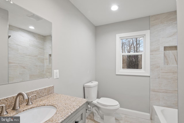 bathroom featuring vanity and toilet