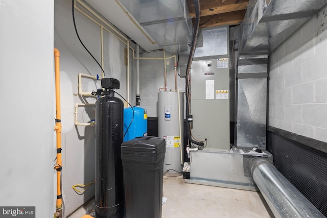 utility room featuring water heater