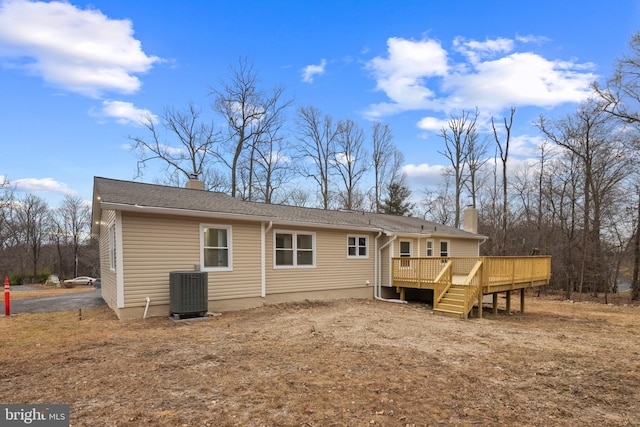 back of property featuring a deck and central air condition unit