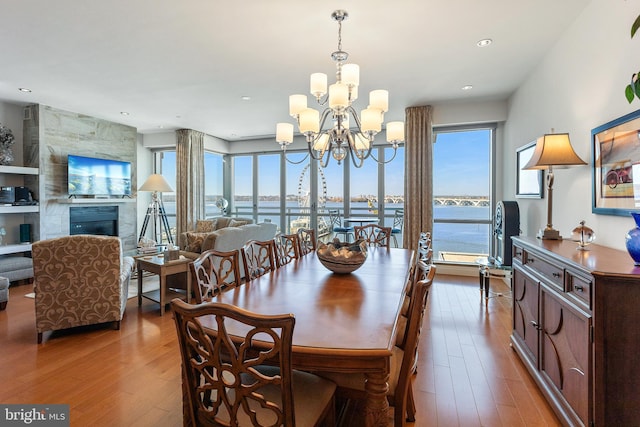 143 Waterfront St Unit 502, National Harbor, MD 20745 - dining area with wood-type flooring, a chandelier, healthy amount of natural light, and recessed lighting