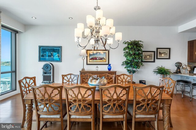 143 Waterfront St Unit 502, National Harbor, MD 20745 - dining area featuring a chandelier, wood finished floors, plenty of natural light, and recessed lighting