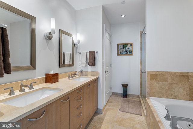 143 Waterfront St Unit 502, National Harbor, MD 20745 - full bathroom with a whirlpool tub, double vanity, tiled shower, baseboards, and recessed lighting