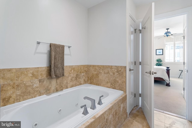 bathroom featuring a relaxing tiled tub, tile patterned flooring, and ceiling fan