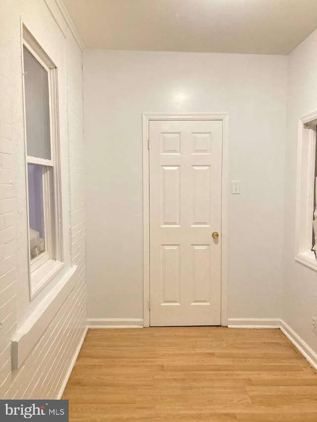 hallway with light wood-type flooring