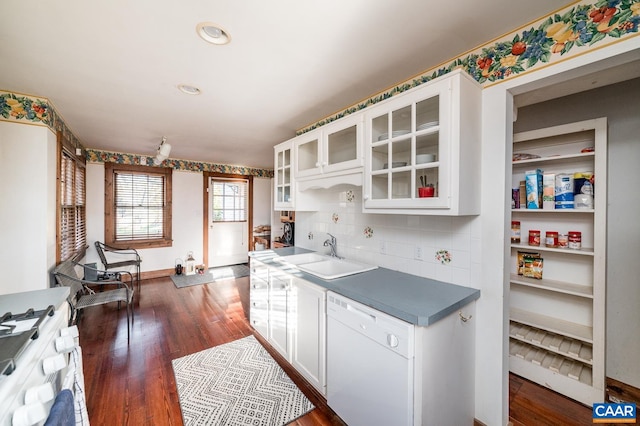 kitchen with white cabinets, tasteful backsplash, dark hardwood / wood-style flooring, sink, and white appliances