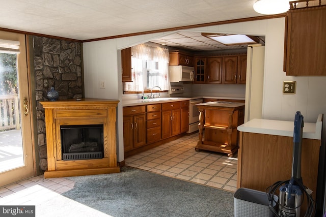 30 Sunset Ln, Catawissa, PA 17820 - kitchen featuring ornamental molding, brown cabinets, a sink, and white appliances