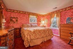 bedroom with dark colored carpet