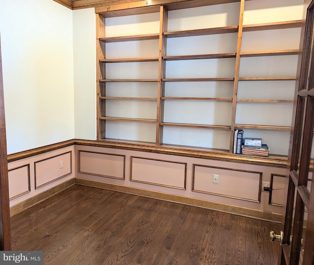 details featuring hardwood / wood-style floors and built in shelves