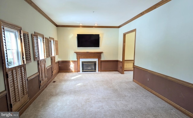 unfurnished living room with crown molding and light colored carpet