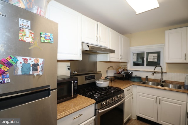 kitchen featuring sink, white cabinetry, and stainless steel appliances