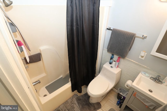 full bathroom with vanity, shower / bath combo, toilet, and tile patterned floors