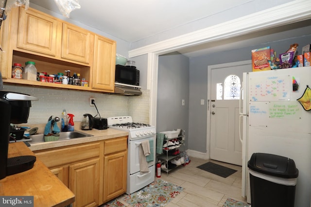 kitchen featuring white appliances, backsplash, sink, and exhaust hood