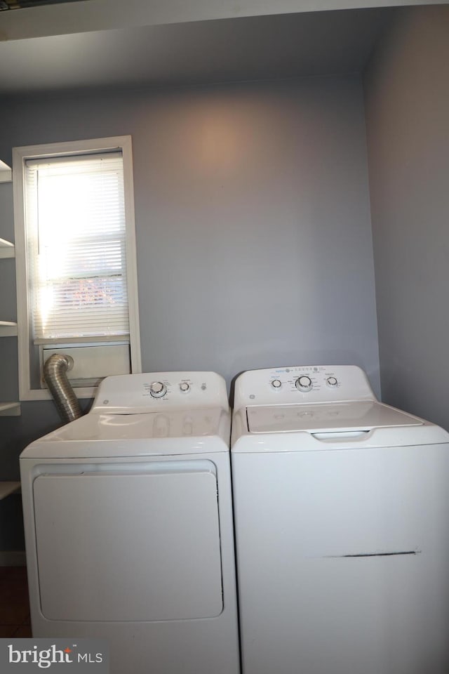 washroom with washer and dryer