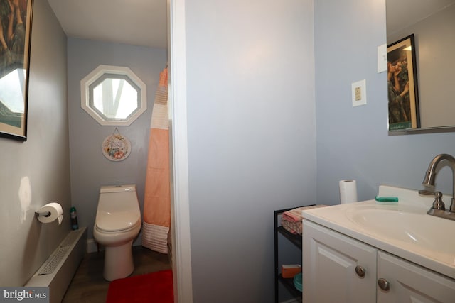 bathroom with vanity, toilet, and a shower with curtain