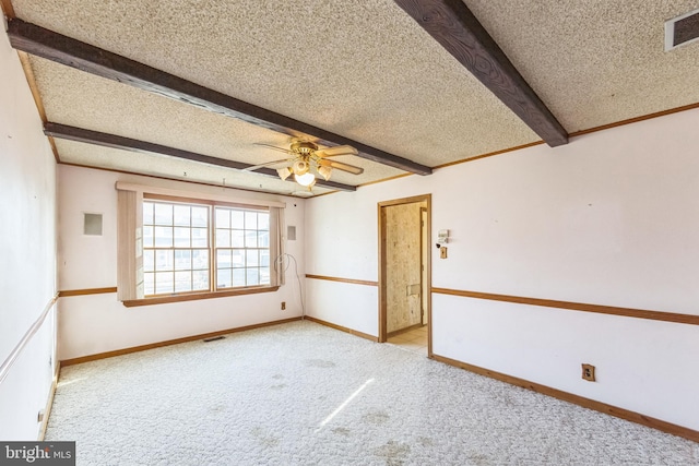 unfurnished room with light carpet, a textured ceiling, beam ceiling, and ceiling fan