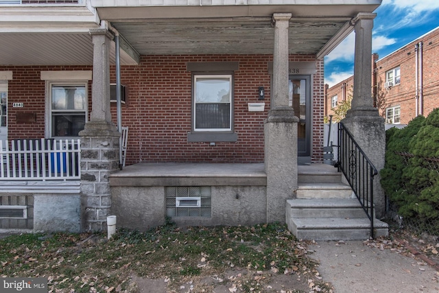 doorway to property with a porch