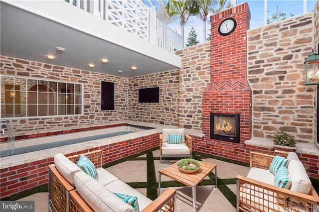 view of patio / terrace with a balcony and an outdoor hangout area