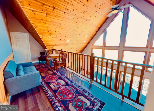 living area featuring ceiling fan, wood ceiling, lofted ceiling, and wood-type flooring