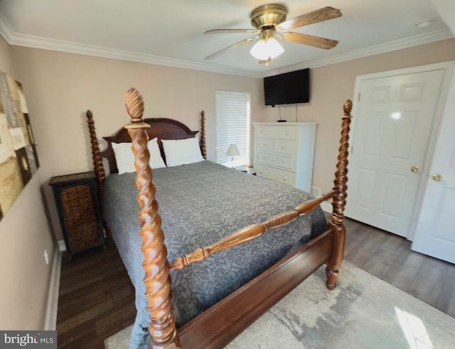 bedroom with ceiling fan, dark hardwood / wood-style floors, and ornamental molding