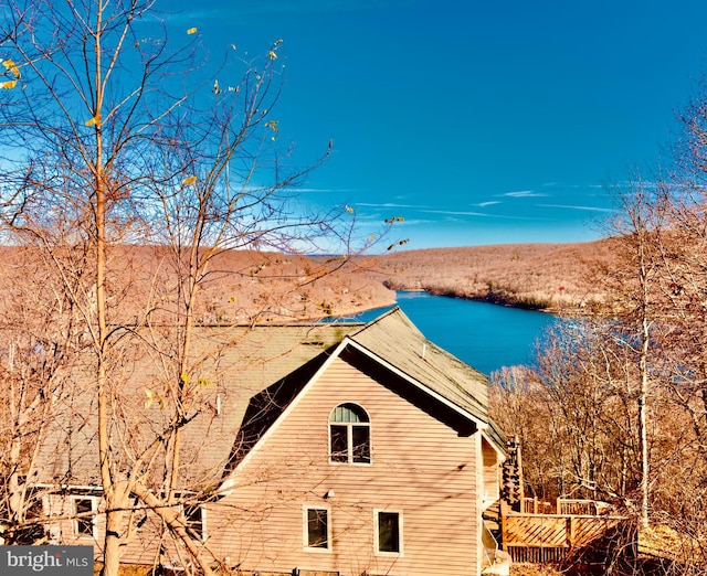 view of side of property with a water view