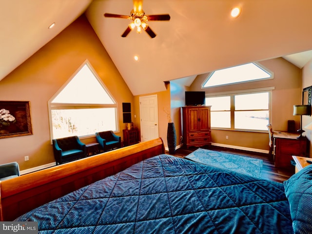 bedroom with hardwood / wood-style flooring, ceiling fan, and lofted ceiling