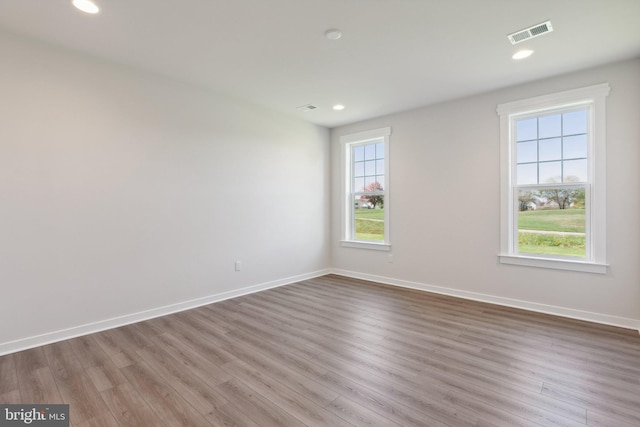 spare room featuring light wood-type flooring