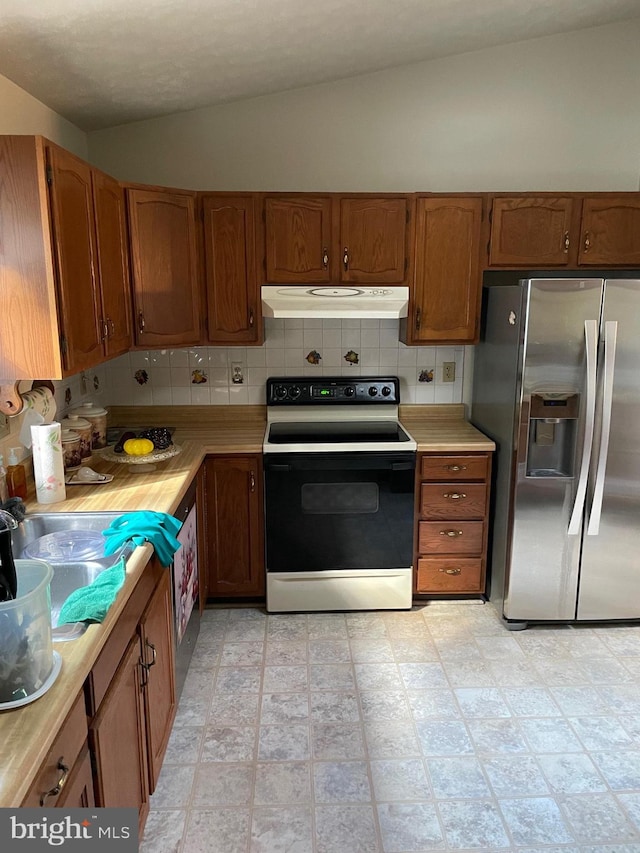 kitchen with range with electric cooktop, vaulted ceiling, stainless steel fridge with ice dispenser, and decorative backsplash