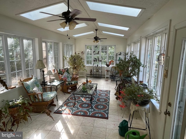 sunroom with ceiling fan, lofted ceiling, and plenty of natural light