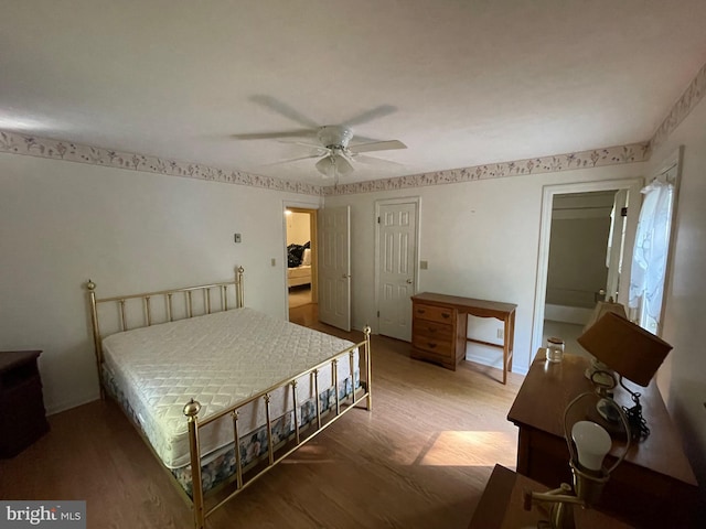 bedroom with ceiling fan and wood-type flooring