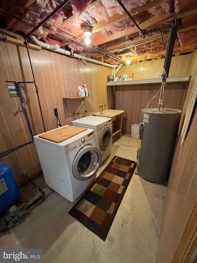 laundry room featuring independent washer and dryer and water heater